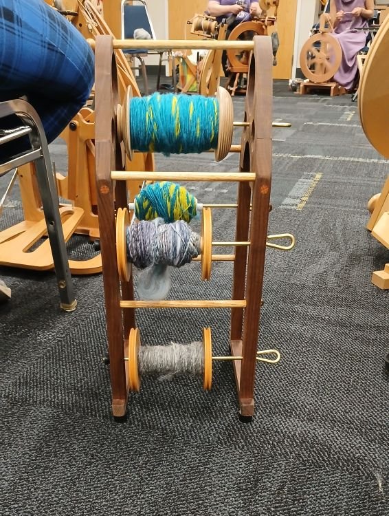 Yarn on a bobbin holder- cottagespinsew.com